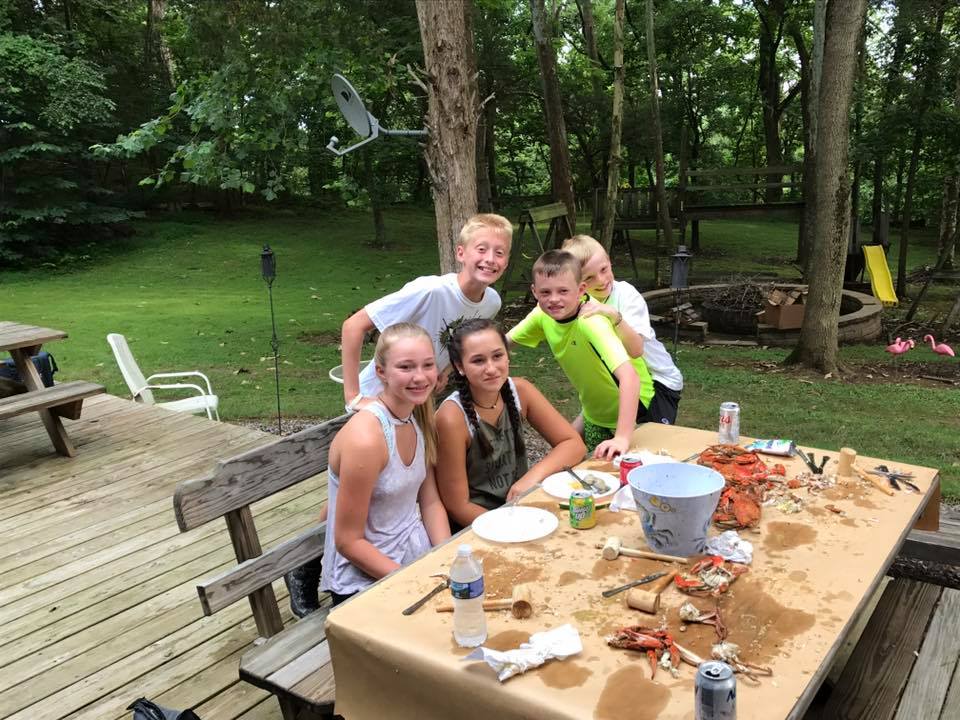 The kids enjoying Maryland crabs at Timber Valley Retreat.