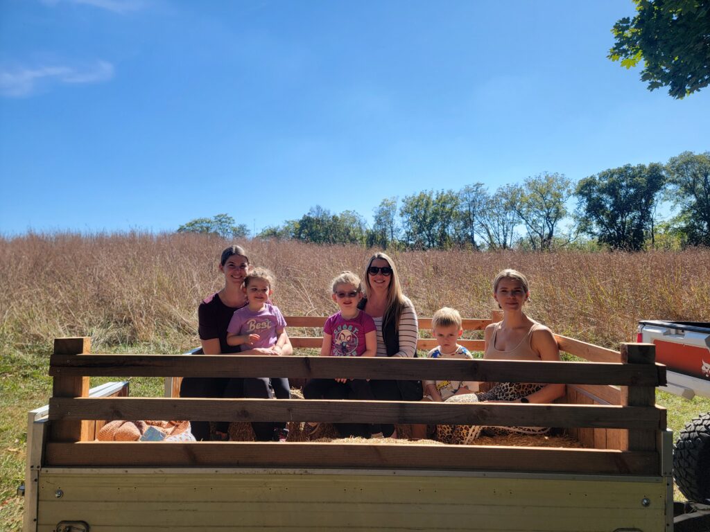 2. Private Hayrides Through the Timber 🚜🌲
Imagine the crisp autumn air as you and your family enjoy a classic hayride. As an official production of Timber Valley Retreat, our hayrides take you through the vibrant, autumn-colored woods and rolling meadows. This isn’t a crowded commercial ride; it is a personal tour of the land we love, making it a highlight of your Fall Family Getaway Maryland.