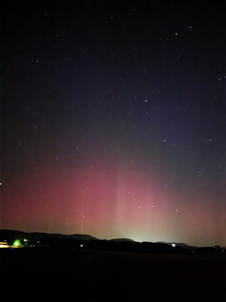 Seeing the Northern Lights, or the Aurora Borealis, is often described as a "bucket list" item, but experiencing them in the crisp, pre-dawn air of our own backyard felt like a gift from the universe. The sky transitioned from deep indigo to vibrant ribbons of emerald green and shimmering violet. It was, quite simply, stunning. 💚💜