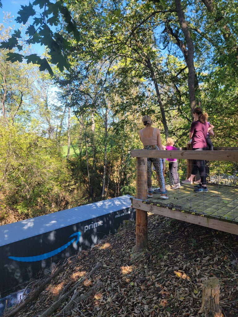 Family enjoying Train Watching Maryland from the Timber Valley Railroad Overlook during a Western Maryland Cabin Retreat at Timber Valley Retreat, one of the most memorable Things to Do in Maryland.