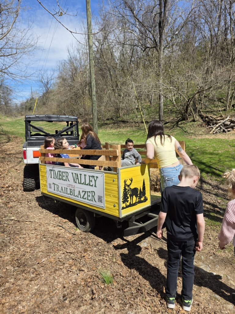 Children enjoying a ride on the Little Trailblazer at Timber Valley Retreat during a Family Cabin Getaway Maryland at our Western Maryland Cabin.