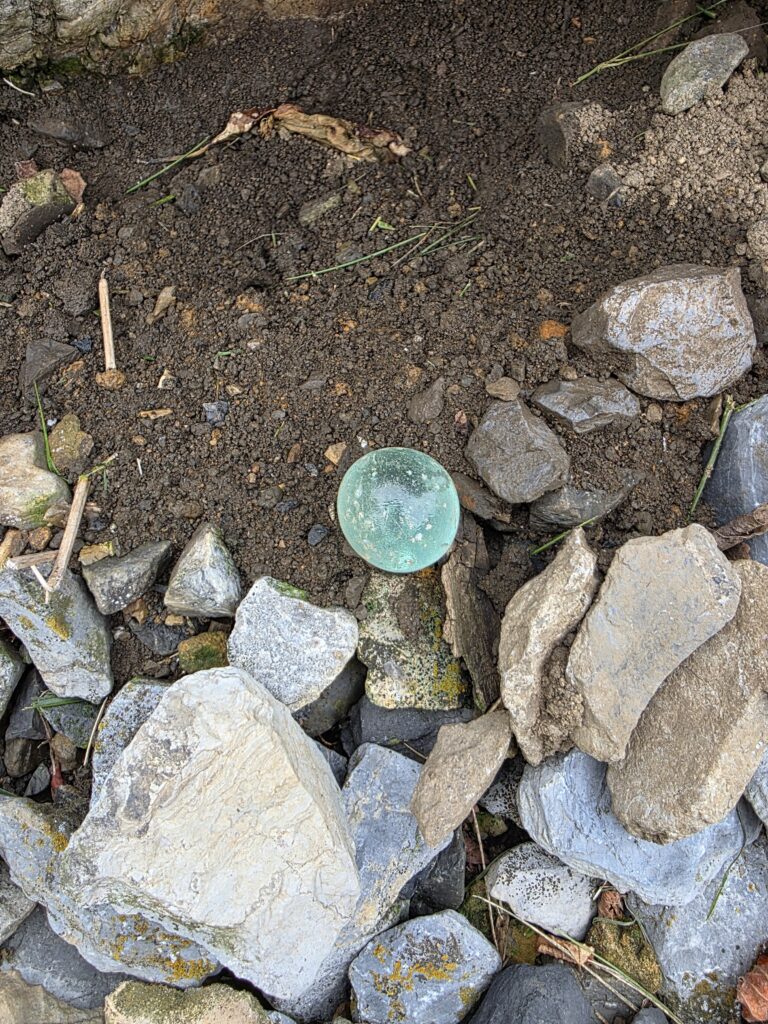 Vintage railroad artifacts like glass marbles collected by Tom and Karen at Timber Valley Retreat, highlighting Train Watching Maryland and unique Things to Do in Maryland.