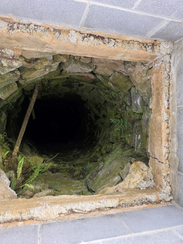 The historic Hand Dug Well Maryland visitors discover at Timber Valley Retreat still protects a natural spring flowing beneath the farm.