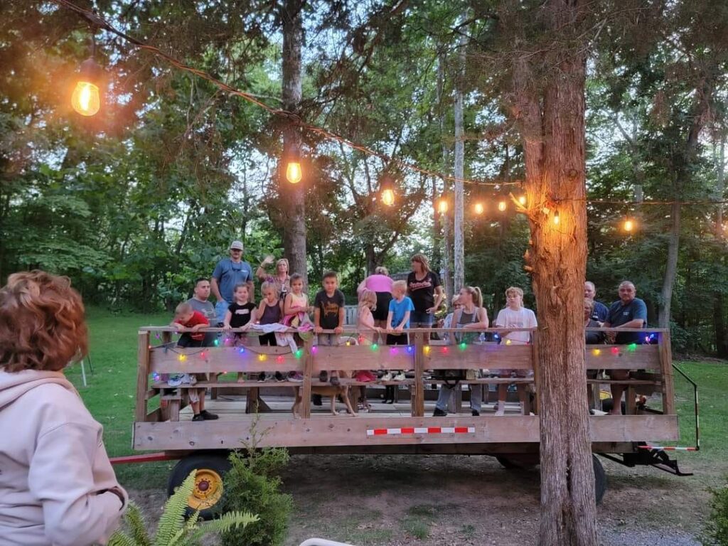 Registered overnight guests enjoying the Timber Valley Trailblazer wagon ride at Timber Valley Retreat in Clear Spring, Maryland as Karen welcomes guests to the experience.