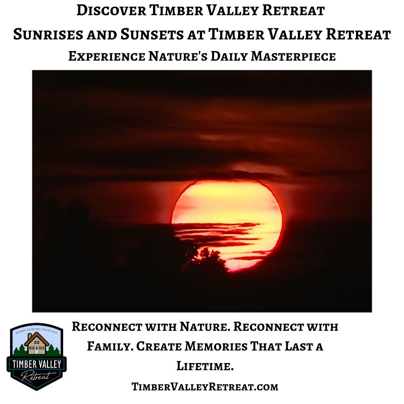 Brilliant red sunrise rising above the tree line at Timber Valley Retreat in Western Maryland, creating a breathtaking start to the day.