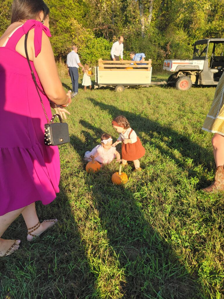 Glamping Near Me at Timber Valley Retreat with families enjoying a fall hay ride and pumpkin patch