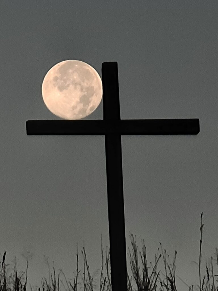 Moon setting beside The Cross on the Hill at Timber Valley Retreat, an Exclusive Private Cabin Retreat in Washington County, Maryland near Washington DC, Northern Virginia, Pennsylvania, West Virginia, and Maryland's Eastern Shore.