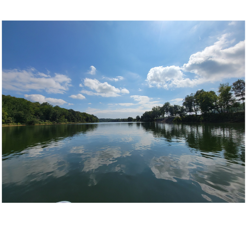 Potomac River near Timber Valley Retreat in Western Maryland with wooded shoreline and blue sky