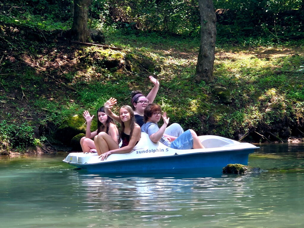 Girl Scouts enjoying time on the water during a Group Cabin Getaway Maryland at Timber Valley Retreat