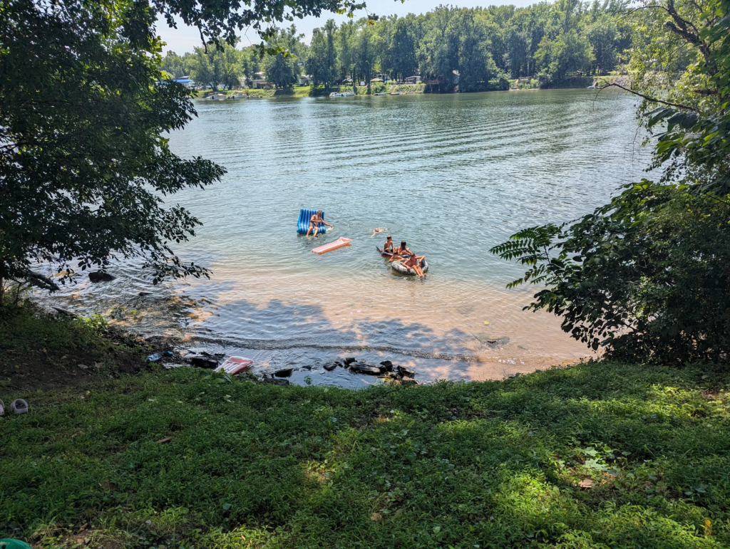 Family and children enjoying the river together during a nature getaway at Timber Valley Retreat.