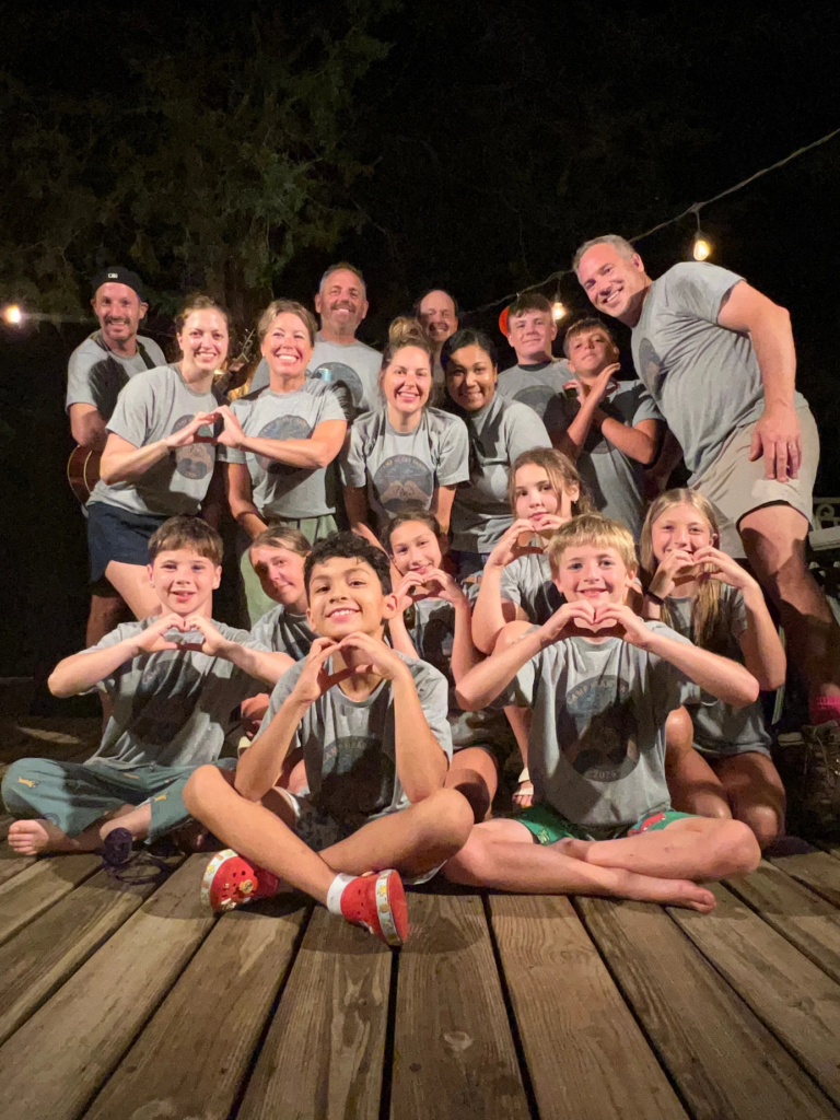Family and friends gathered together at Timber Valley Retreat after enjoying a nature-filled getaway
