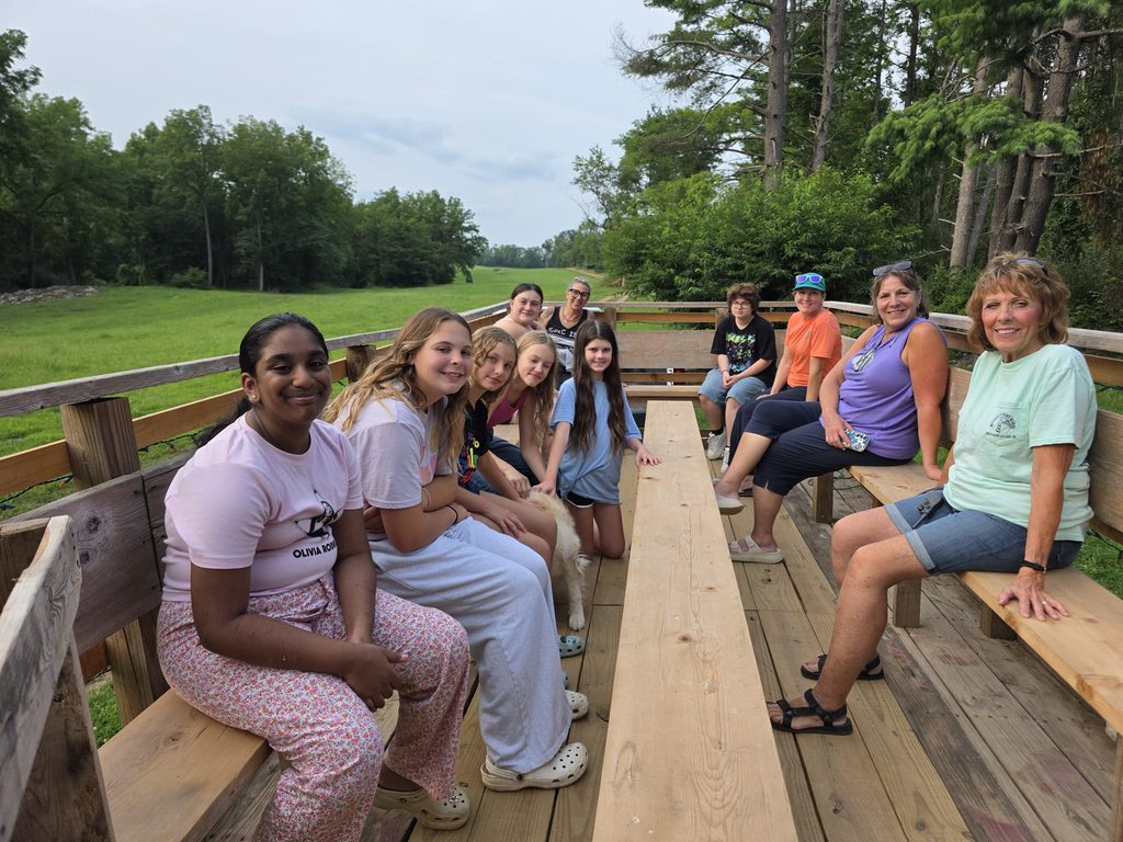 Group Camping Near Me with a Girl Scout troop enjoying a Timber Valley Trailblazer wagon ride with Karen at Timber Valley Retreat