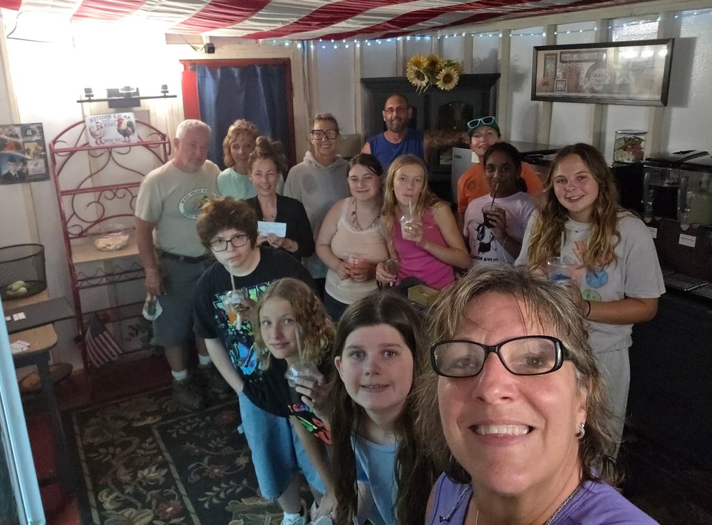 Youth Group Camping Maryland with Girl Scout troop and leaders enjoying time together during a Timber Valley Trailblazer wagon ride